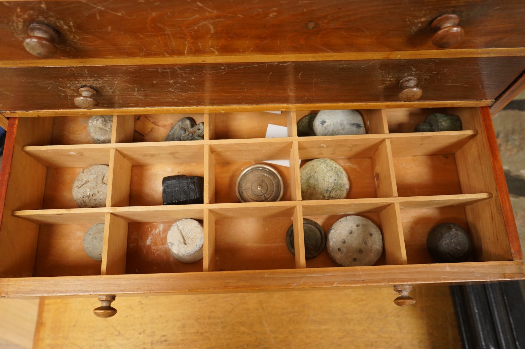 A collection of mainly 16th century to 19th century bronze and lead imperial circular trade weights stamped with Royal Cyphers, weights, the dagger assay mark for London, the ewer mark, other proof marks, etc., together